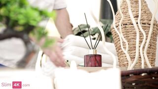 Young Asian teen Ashly Rabbit gets a creamy surprise during a steamy massage