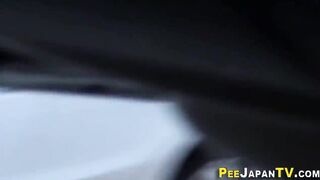 Watch this kinky Japanese babe get drenched in golden showers while peeing in public - 9 image