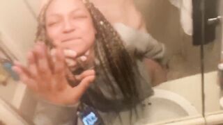 Blasian bent over bathroom sink while roommates in other room - 3 image
