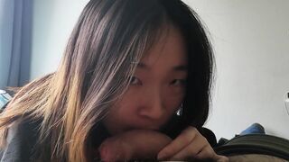 Cute asian babe sucks her BF's white cock and takes a facial POV - 2 image